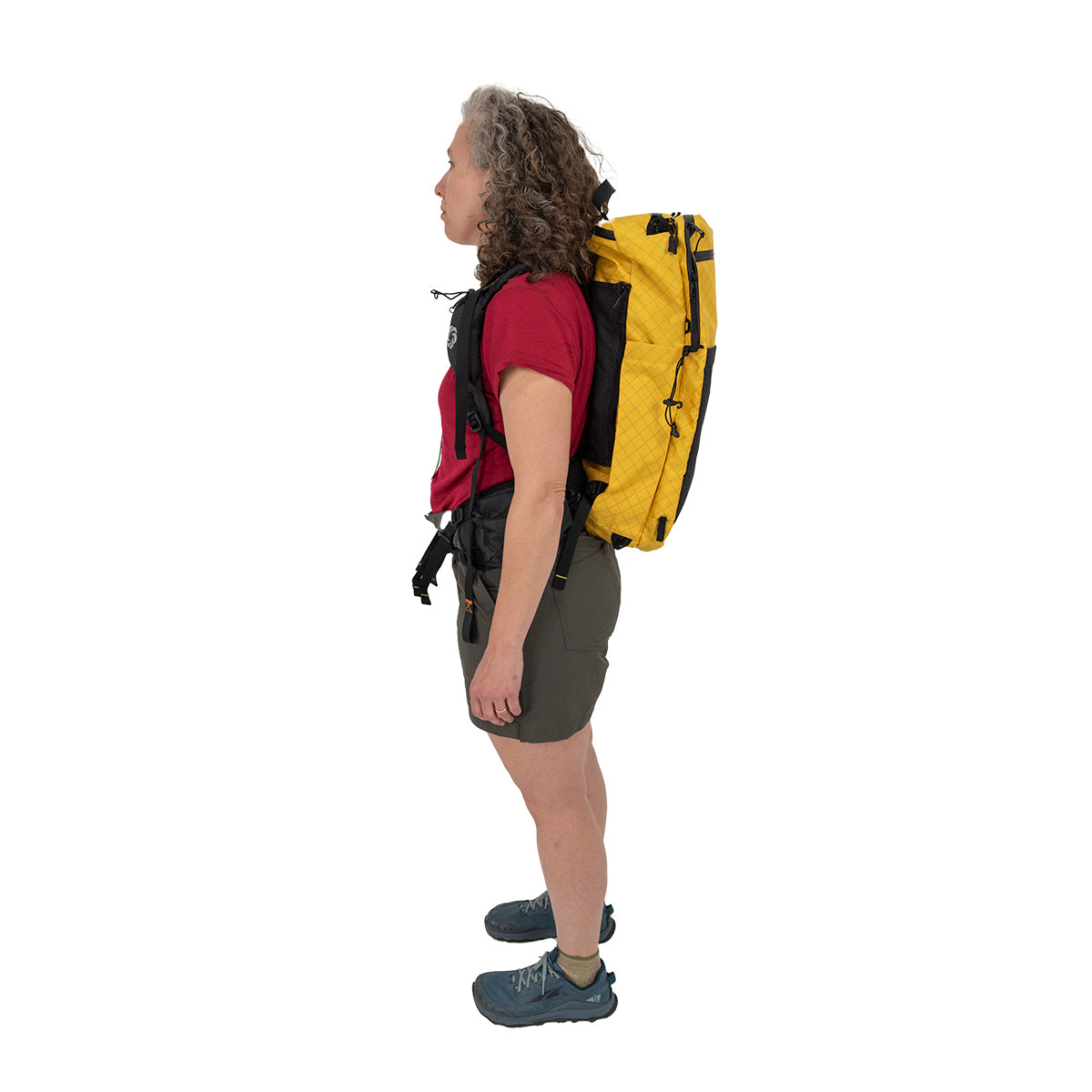 ADC Golden Dazy being worn by a woman who is facing the left standing against a white background.