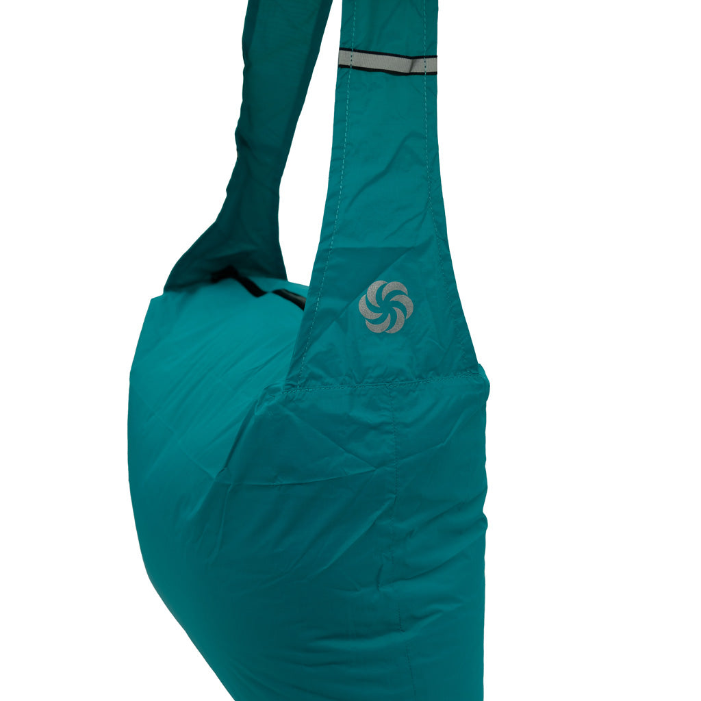 Grocery Go Getter in Blue stuffed and showing the Six Moon Designs logo on the strap