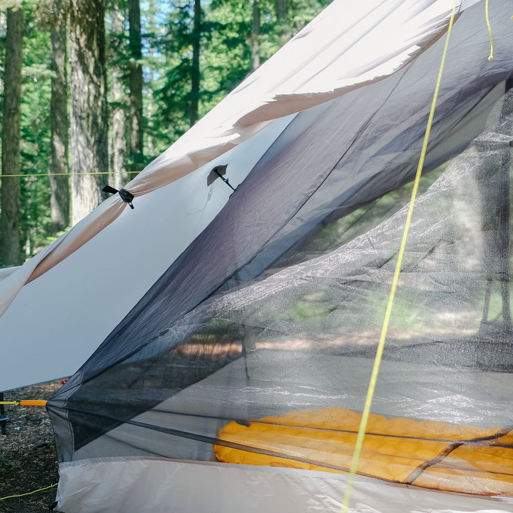 Gray Haven Tent looking inside the door showing how the NetTent attaches to the tarp.