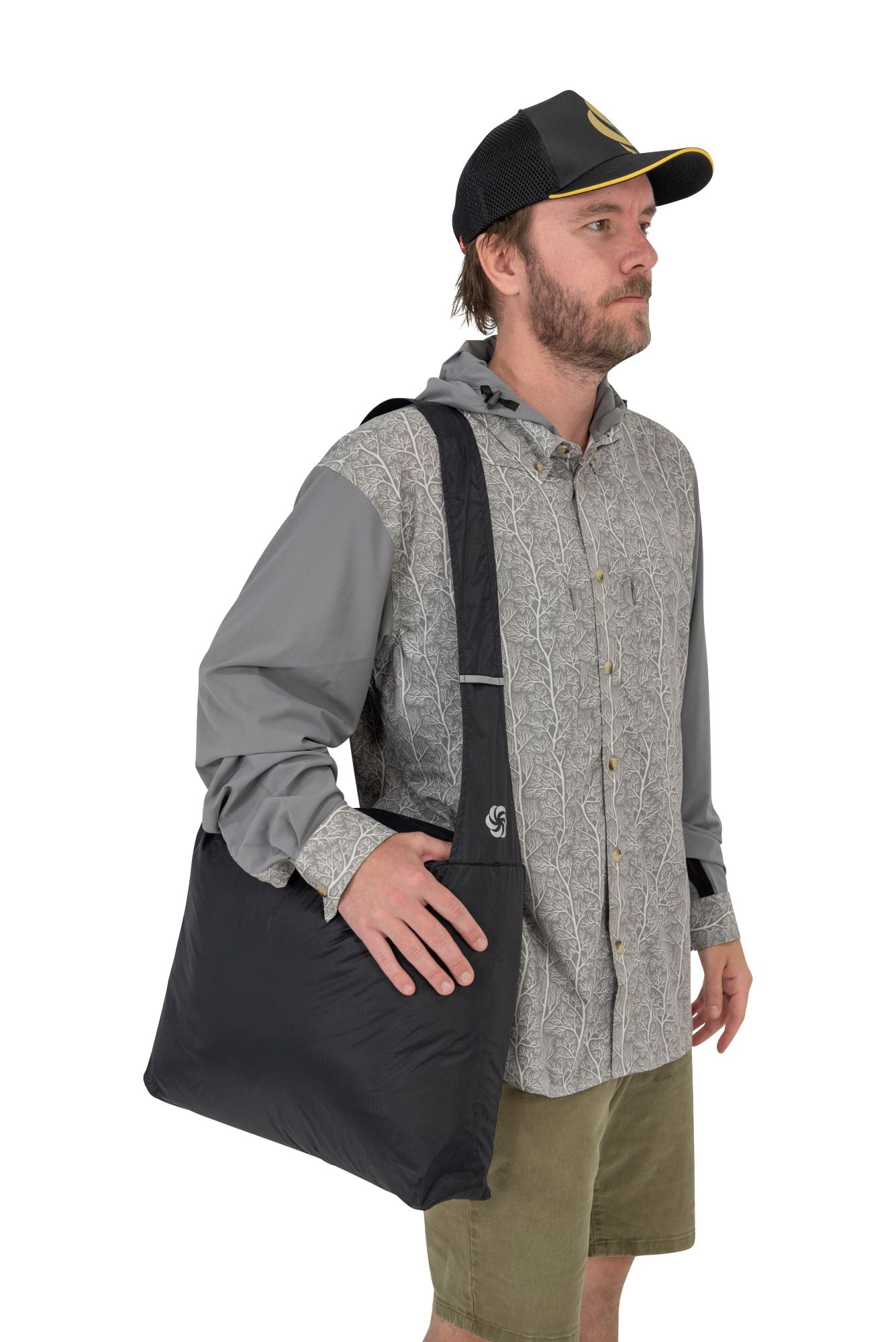 Orange Grocery Go Getter being worn by a man with it slung over his shoulder.  The Man is turned to the side so he is showing off the side of the product.  
