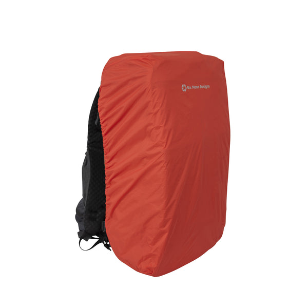 Orange Shower Cap on a backpack with a visible Six Moon Designs logo on a white background facing 3/4 to the side.  